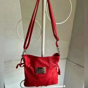 Nicole Miller coral shoulder bag.